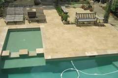 Beige Travertine pool deck and coping
